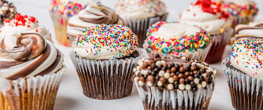 Photo of a bunch of cupcakes on a table